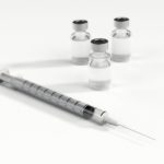 Syringe and three glass pots