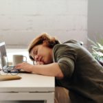 Woman asleep on her laptop